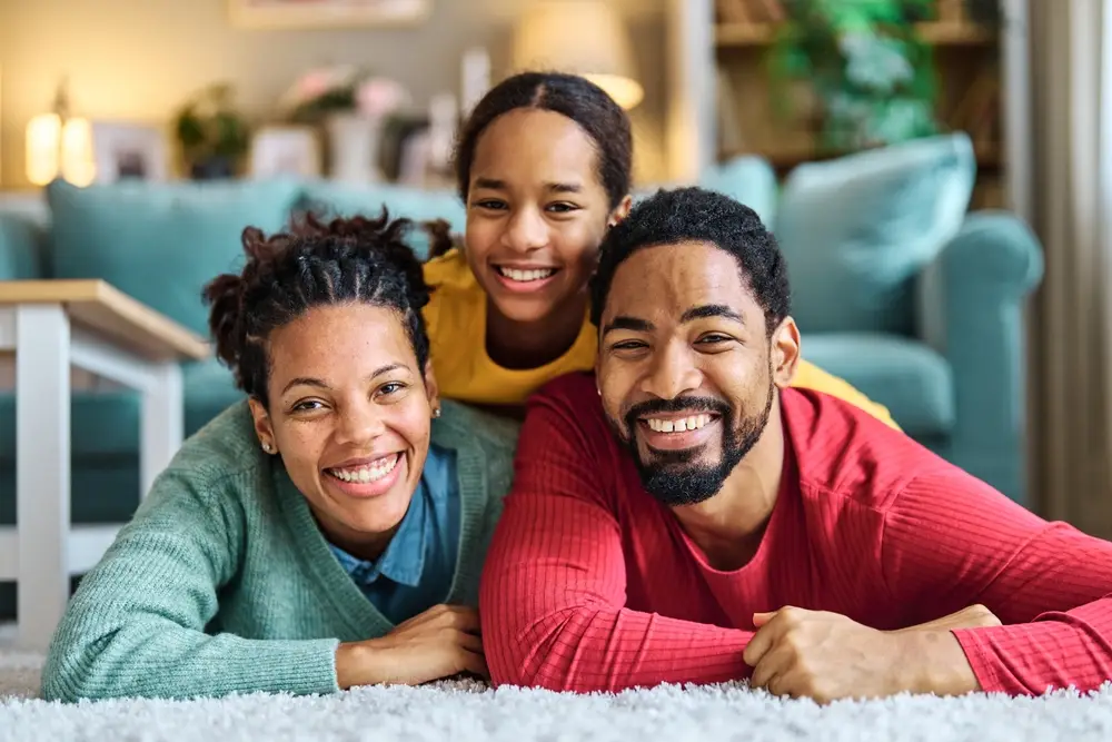 Happy family smiling together, highlighting friendly and family-focused General Dentistry