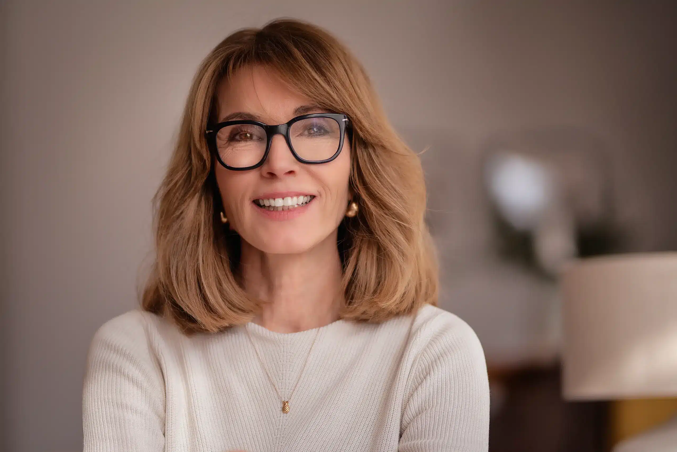 Smiling woman with glasses showing healthy teeth and confidence after Whitening Dental Treatment in Chambersburg PA