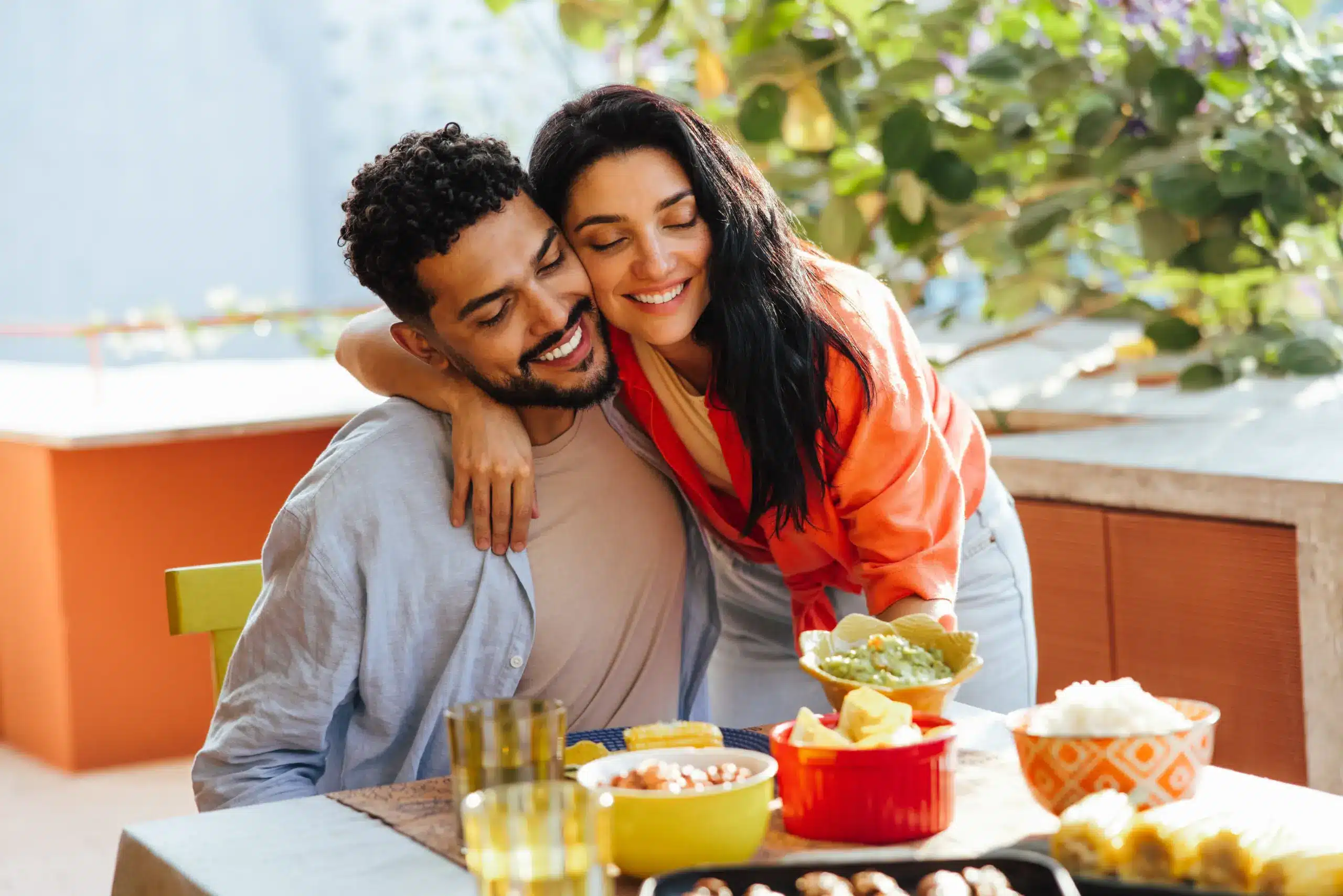 Smiling couple enjoying time together with confident, healthy smiles