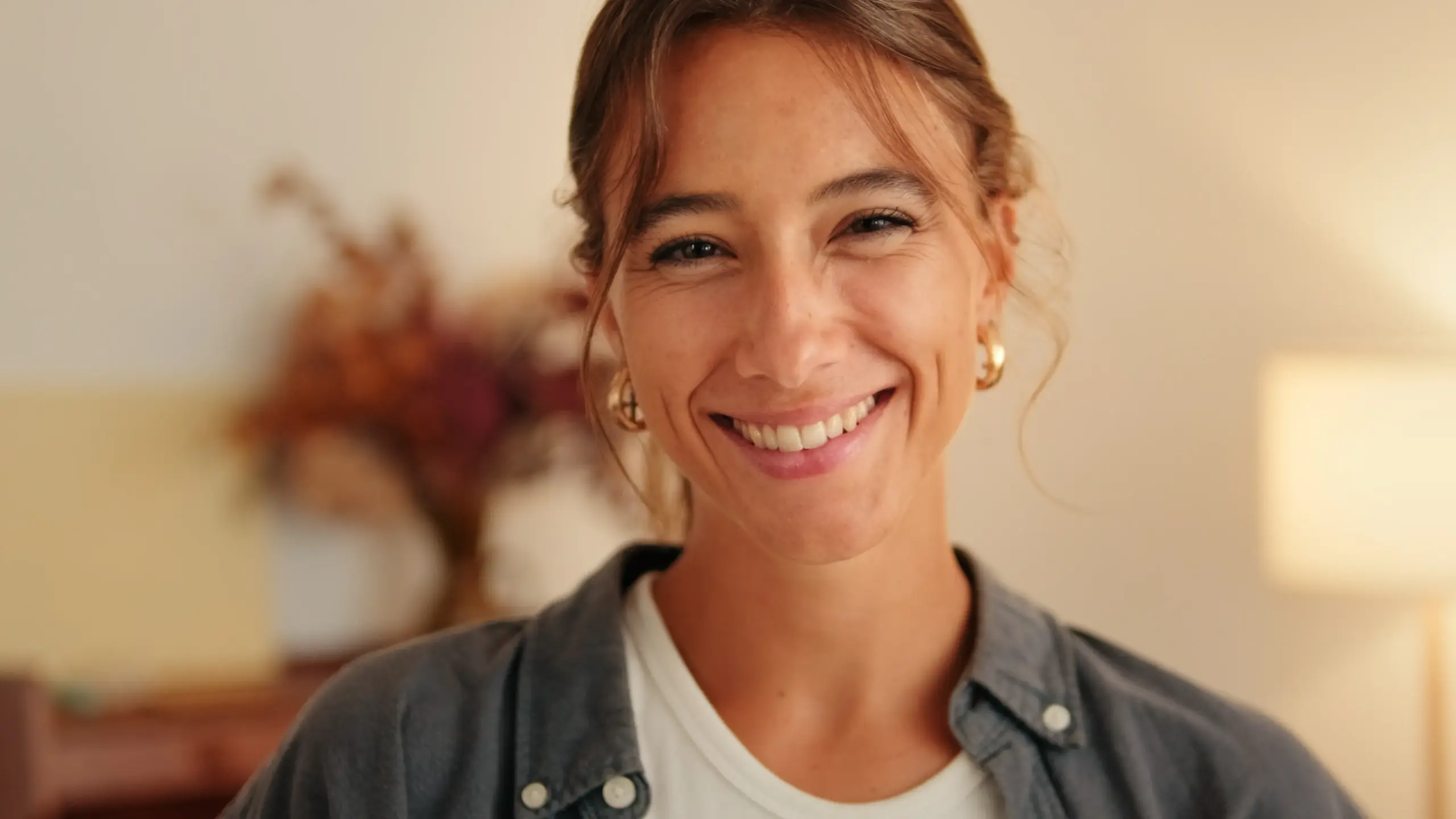 Close-up of a smiling woman showing healthy teeth and natural confidence